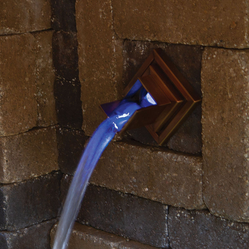 Copper-Finish Verona Wall Spout In use up close at night
