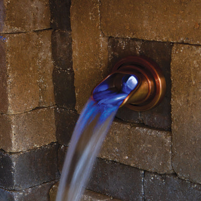 Copper-Finish Olivett Wall Spout In use up close at night